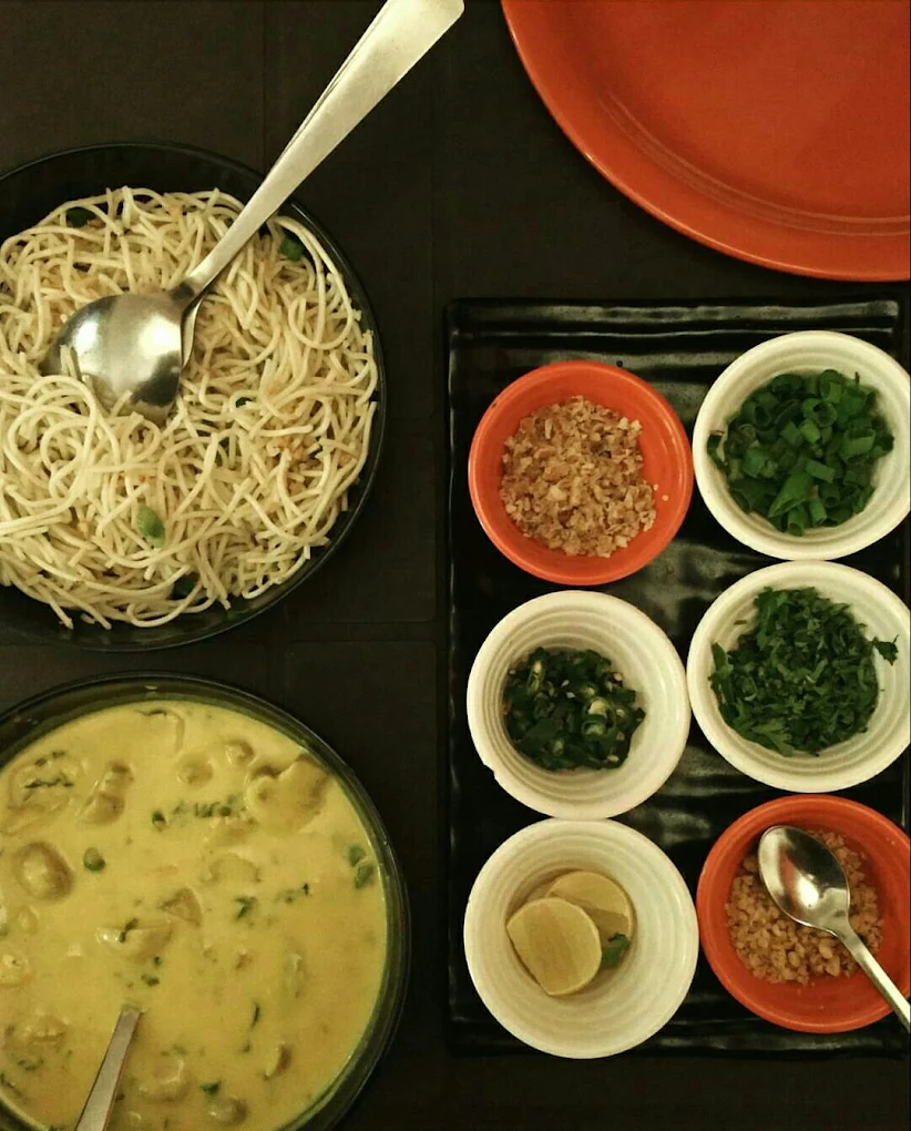 Pan-Asian dish spread with noodles and dumplings, text overlay ‘Pan-Asian Delights Pune’, puneripages.in