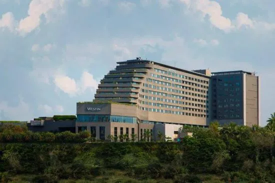 Luxury facade and riverside view of The Westin Pune Koregaon Park
