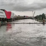 Aerial shot of Pune Airport runway and Viman Nagar streets submerged by heavy rain, overlaid with the text ‘Pune Airport Flooding & Viman Nagar Deluge’ and website branding ‘puneripages.in’.