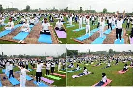 Mass yoga session, Ayurveda stalls, spiritual discourses, and breathing workshops.