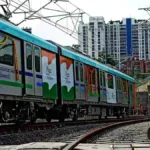 Pune Metro Line 3 train on elevated tracks over Hinjewadi area during trial run.