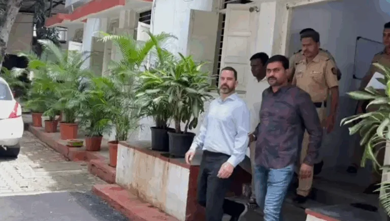 Police vehicle outside Pimpri-Chinchwad police station, representing the arrest of a U.S. citizen in a forced conversion case