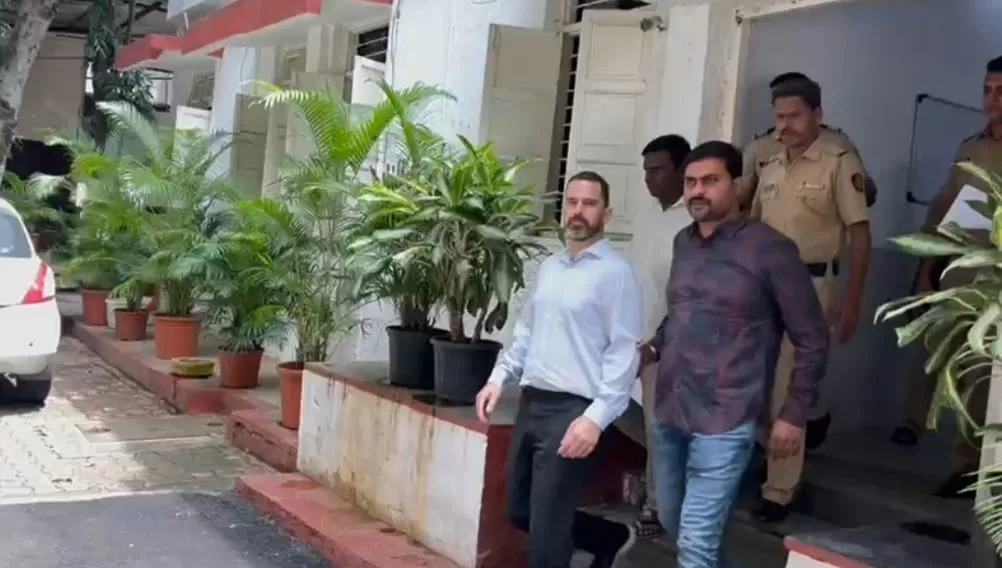 Police vehicle outside Pimpri-Chinchwad police station, representing the arrest of a U.S. citizen in a forced conversion case