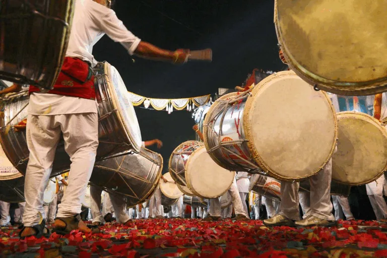 Kalavant Dhol Tasha Pathak performing in a Pune street procession celebrating 12 years of community and music.