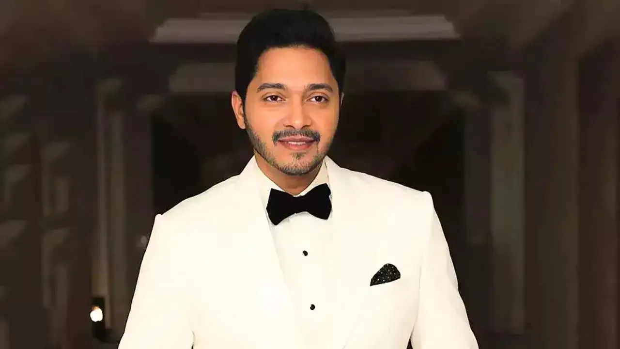 Shreyas Talpade at a press event with serious expression