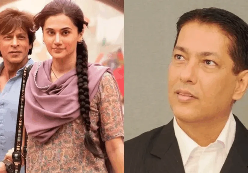 Taran Adarsh with Bollywood movie posters and box office stats in background