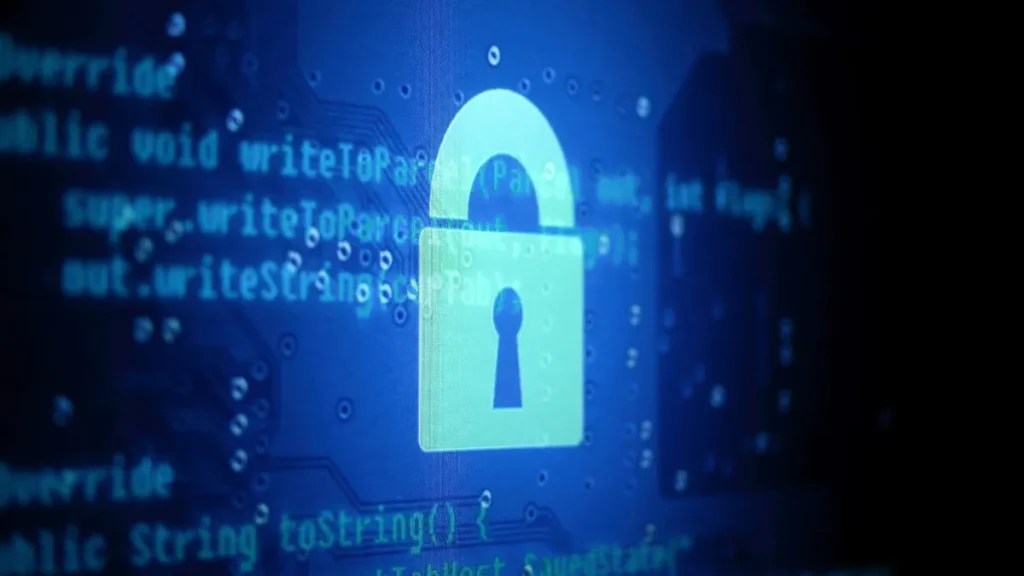 Digital padlock on a screen of code, representing AI hacking and cyber security