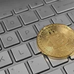 Bitcoin coin on a laptop keyboard, illustrating the Binance crypto hack