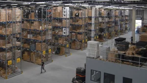 Racks of goods inside a warehouse, representing FDA checks on expired food stock