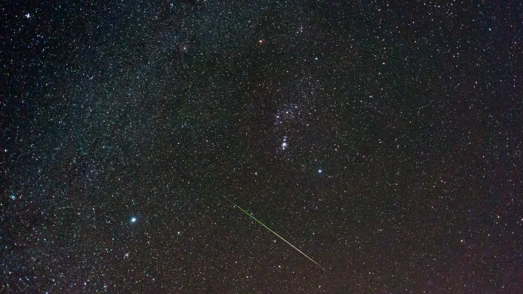 Meteor streaking across a starry night sky during the Leonid meteor shower