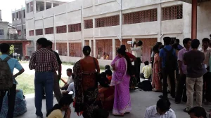 Candidates waiting outside an exam centre in India