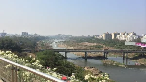 View over Pune city from the riverside on a hazy October day