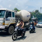 Vehicles and two-wheelers on a busy road in Pune